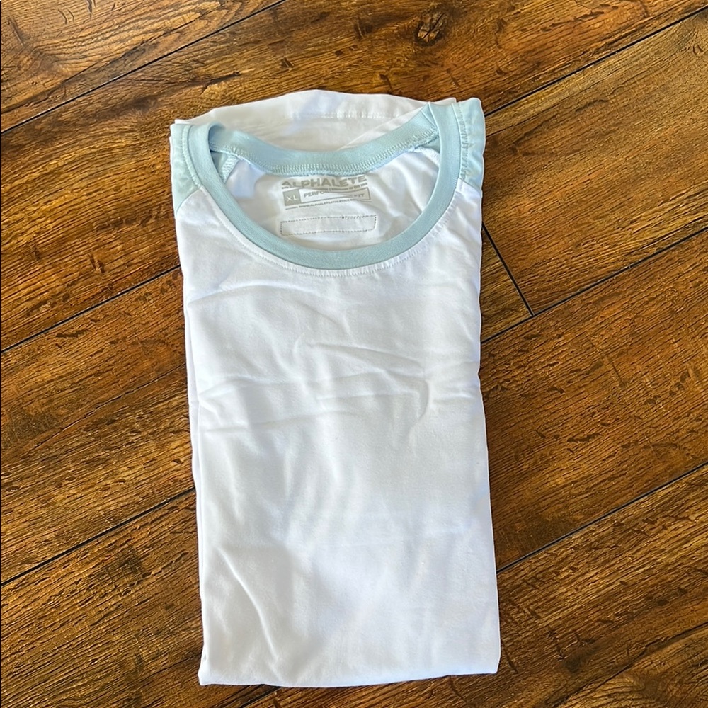 Alphalete White Tee with Light Blue Trim